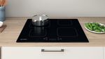 Indesit Piano cottura IS 15Q60 NE Nero Induction vitroceramic Lifestyle frontal top down